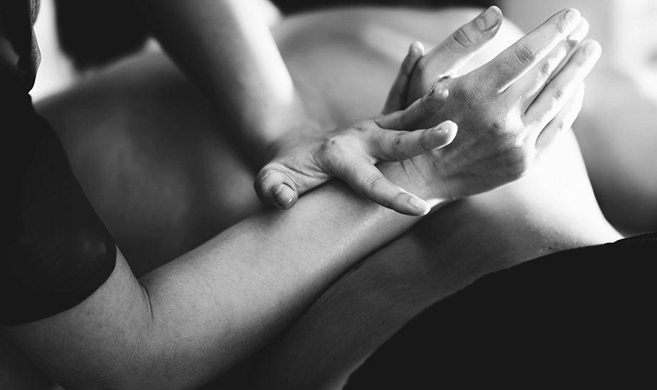 Massage therapist giving massage